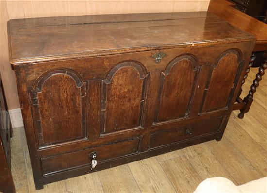 An 18th century panelled oak mule chest W.127cm